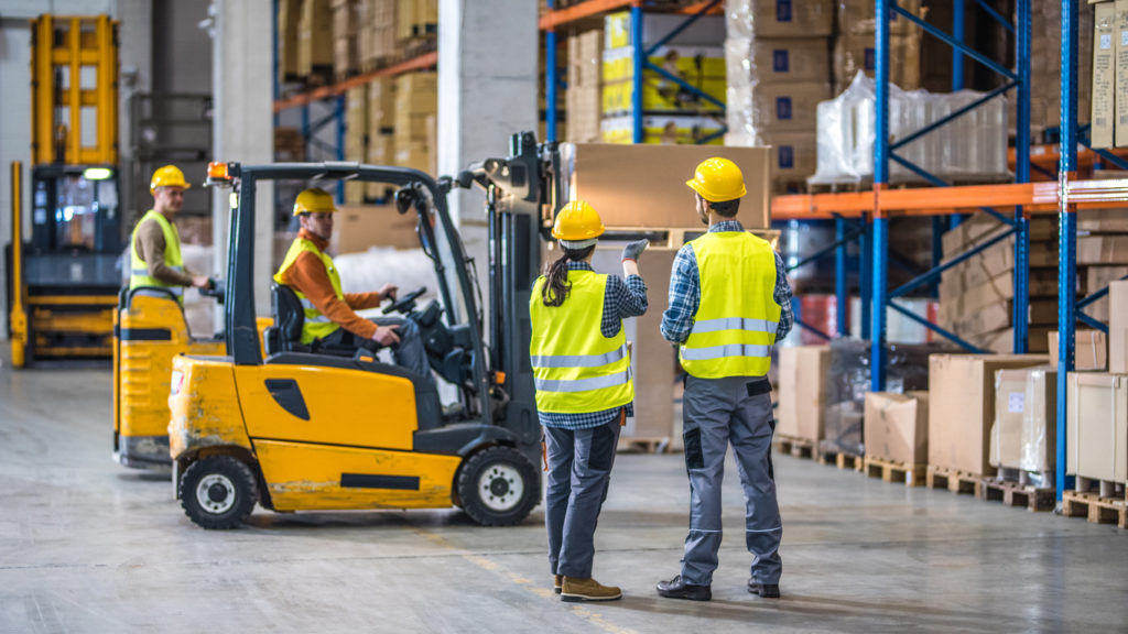 Warehouse Workers Loading Static Pallet Rack